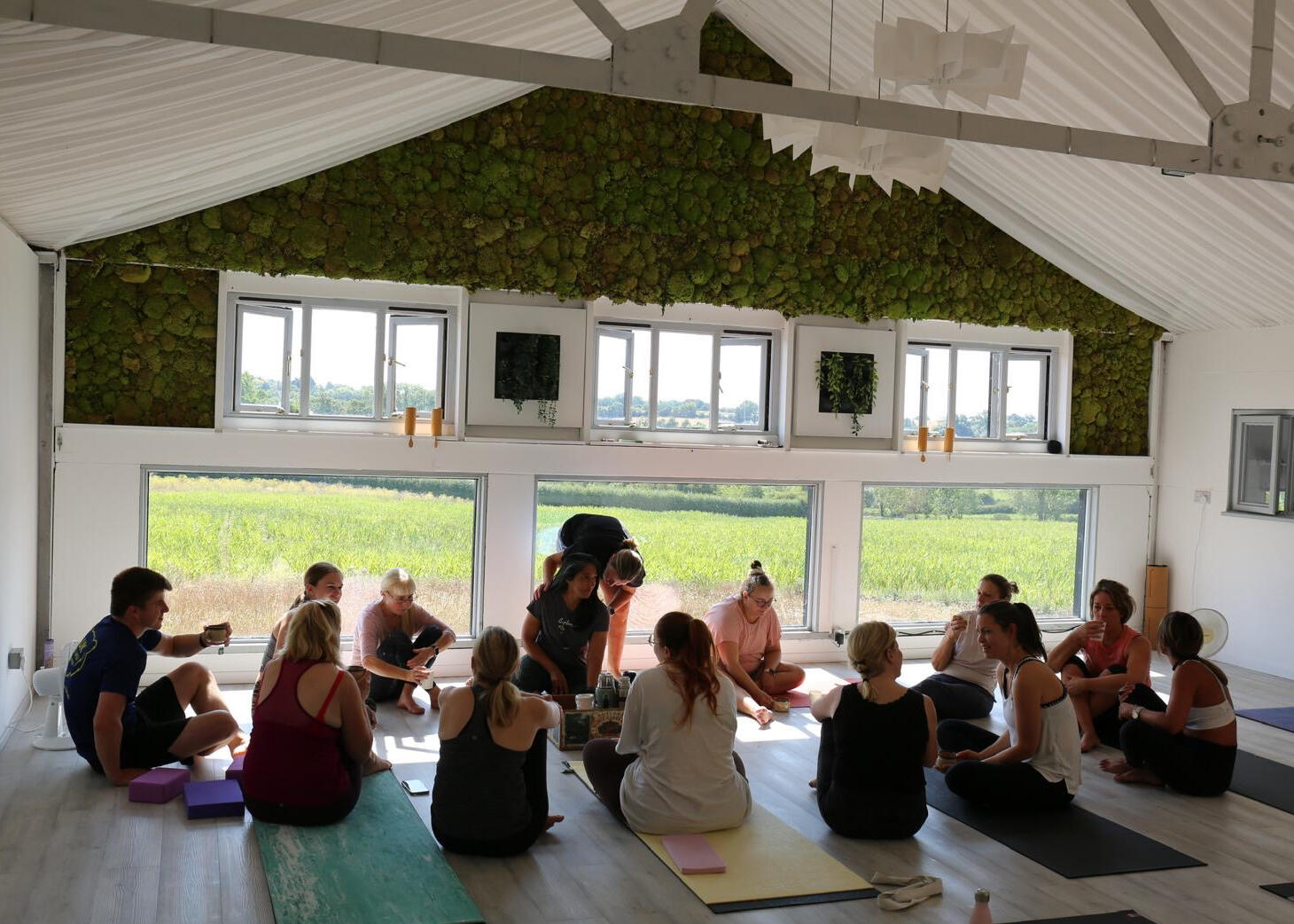 Group sitting together after yoga class at Thaxted Wellness Hub, Essex Group sitting together after yoga class at Thaxted Wellness Hub, Essex
